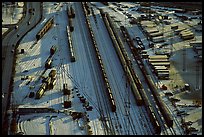 Rail tracks and cargo cars in winter. Calgary, Alberta, Canada (color)