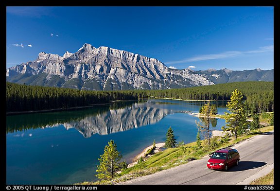 Car on the road besides Two Jack Lake. Banff National Park, Canadian Rockies, Alberta, Canada