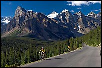 Cyclists on the road to the Valley of Ten Peaks. Banff National Park, Canadian Rockies, Alberta, Canada