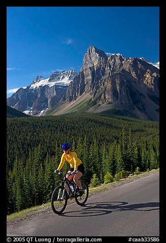 Cyclist on the road to the Valley of Ten Peaks. Banff National Park, Canadian Rockies, Alberta, Canada (color)