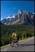 Cyclist on the road to the Valley of Ten Peaks. Banff National Park, Canadian Rockies, Alberta, Canada ( color)