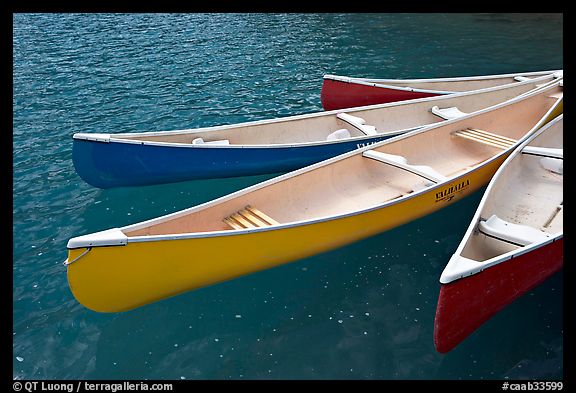 Close up of brightly colored canoes, Moraine Lake. Banff National Park, Canadian Rockies, Alberta, Canada