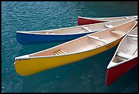 Close up of brightly colored canoes, Moraine Lake. Banff National Park, Canadian Rockies, Alberta, Canada