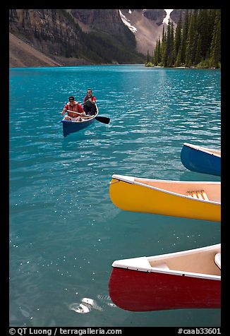 Colorful canoes and conoeists on Moraine Lake. Banff National Park, Canadian Rockies, Alberta, Canada