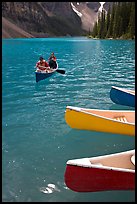 Colorful canoes and conoeists on Moraine Lake. Banff National Park, Canadian Rockies, Alberta, Canada (color)