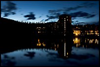 Chateau Lake Louise Hotel reflected in Lake at night. Banff National Park, Canadian Rockies, Alberta, Canada