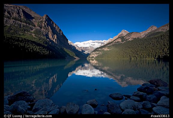 Mountains reflected in Lake Louise, early morning. Banff National Park, Canadian Rockies, Alberta, Canada (color)