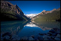 Mountains reflected in Lake Louise, early morning. Banff National Park, Canadian Rockies, Alberta, Canada