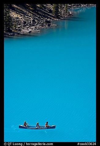 Canoe floatting in Robins egg blue water of Moraine Lake. Banff National Park, Canadian Rockies, Alberta, Canada (color)