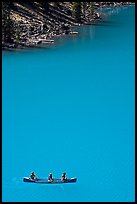 Canoe floatting in Robins egg blue water of Moraine Lake. Banff National Park, Canadian Rockies, Alberta, Canada