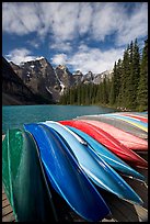 Colorful canoes stacked on the boat dock, Lake Moraine, morning. Banff National Park, Canadian Rockies, Alberta, Canada (color)