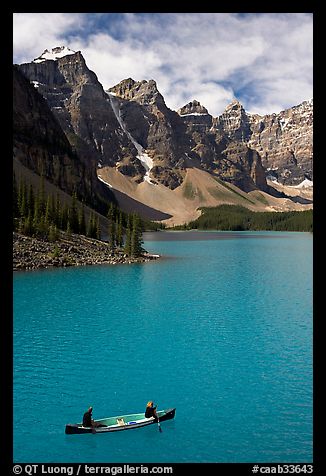 Canoeists below  Wenkchemna Peaks, Moraine Lake, mid-morning. Banff National Park, Canadian Rockies, Alberta, Canada