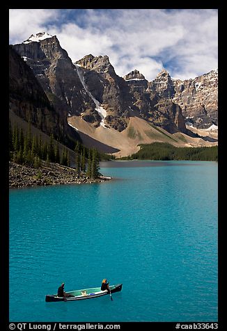 Canoeists below  Wenkchemna Peaks, Moraine Lake, mid-morning. Banff National Park, Canadian Rockies, Alberta, Canada (color)