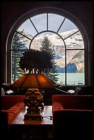 Lake Louise seen through a window of Chateau Lake Louise hotel. Banff National Park, Canadian Rockies, Alberta, Canada