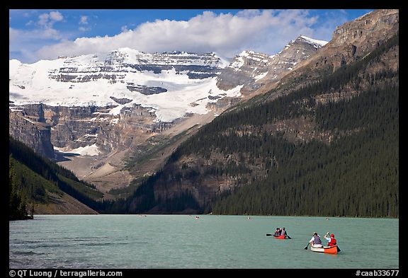 Canoes, Victoria Peak, and blue-green glacially colored Lake Louise, morning. Banff National Park, Canadian Rockies, Alberta, Canada (color)