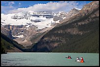 Canoes, Victoria Peak, and blue-green glacially colored Lake Louise, morning. Banff National Park, Canadian Rockies, Alberta, Canada (color)