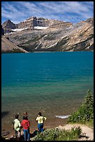 Family standing on the shores of Bow Lake. Banff National Park, Canadian Rockies, Alberta, Canada