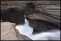 River flowing through narrow rock gorge, Mistaya Canyon. Banff National Park, Canadian Rockies, Alberta, Canada (color)