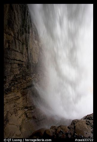 Curtain of water of Panther Falls, seen from behind. Banff National Park, Canadian Rockies, Alberta, Canada (color)
