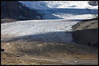 Base of Athabasca Glacier with cars parked on lot. Jasper National Park, Canadian Rockies, Alberta, Canada