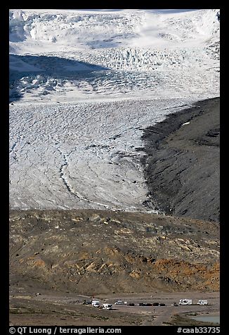 Parking lot dwarfed by Athabasca Glacier. Jasper National Park, Canadian Rockies, Alberta, Canada