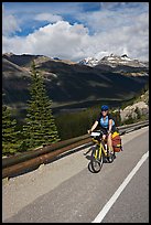 Woman cyclist, Icefieds Parkway. Jasper National Park, Canadian Rockies, Alberta, Canada