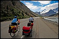 Couple cycling the Icefields Parkway. Jasper National Park, Canadian Rockies, Alberta, Canada