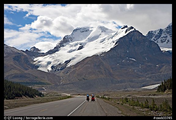 Cyclists on the Icefields Parkway at the base of Mt Athabasca. Jasper National Park, Canadian Rockies, Alberta, Canada