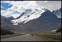 Cyclists on the Icefields Parkway at the base of Mt Athabasca. Jasper National Park, Canadian Rockies, Alberta, Canada