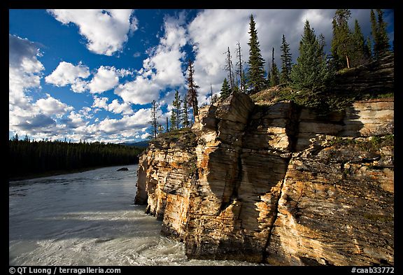 Cliff and Athabasca River, late afternoon. Jasper National Park, Canadian Rockies, Alberta, Canada