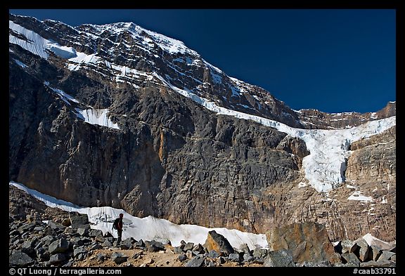 Hiker on a moraine below Mt Edith Cavell and Angel Glacier. Jasper National Park, Canadian Rockies, Alberta, Canada (color)