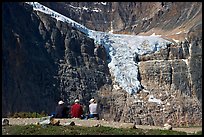 Hikers looking at a hanging glacier on  Mt Edith Cavell. Jasper National Park, Canadian Rockies, Alberta, Canada