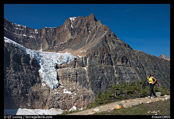 Woman hiking on trail near Mt Edith Cavell. Jasper National Park, Canadian Rockies, Alberta, Canada (color)