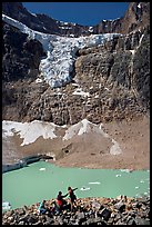 Family looking at Cavell Pond and Angel Glacier. Jasper National Park, Canadian Rockies, Alberta, Canada