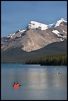 Red canoe on Maligne Lake, afternoon. Jasper National Park, Canadian Rockies, Alberta, Canada