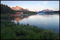 Wildflowers, Maligne Lake and boathouse, sunset. Jasper National Park, Canadian Rockies, Alberta, Canada (color)