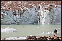 Hiker looking at the face of Cavell Glacier. Jasper National Park, Canadian Rockies, Alberta, Canada (color)