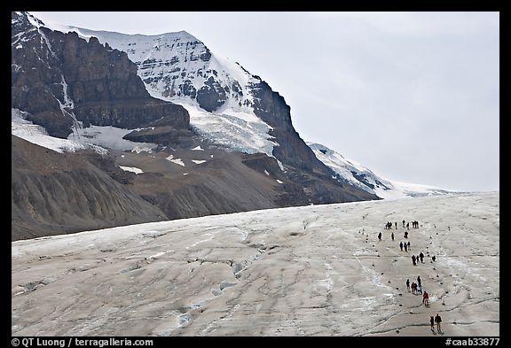 Toe of Athabasca Glacier with tourists in delimited area. Jasper National Park, Canadian Rockies, Alberta, Canada