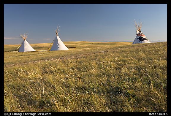 Teepees and tall grass prairie, Head-Smashed-In Buffalo Jump. Alberta, Canada (color)