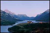 Prince of Wales hotel over Waterton Lakes, dusk. Waterton Lakes National Park, Alberta, Canada