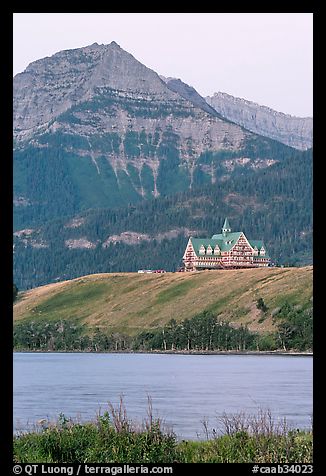 Prince of Wales hotel, lake and mountain, dawn. Waterton Lakes National Park, Alberta, Canada (color)