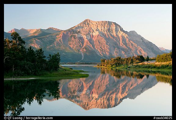 Vimy Peak reflected in Middle Waterton Lake, sunrise. Waterton Lakes National Park, Alberta, Canada