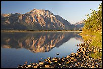 Shoreline with pebbles, Middle Waterton Lake, and Vimy Peak. Waterton Lakes National Park, Alberta, Canada