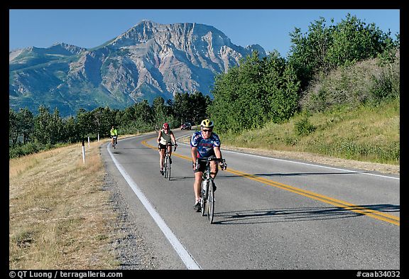 Cyclists on road. Waterton Lakes National Park, Alberta, Canada (color)