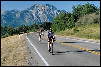 Cyclists on road. Waterton Lakes National Park, Alberta, Canada (color)