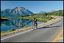 Cyclist next to Lower Waterton Lake. Waterton Lakes National Park, Alberta, Canada ( color)