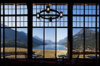 View over Waterton Lake through the windows of Prince of Wales hotel, morning. Waterton Lakes National Park, Alberta, Canada