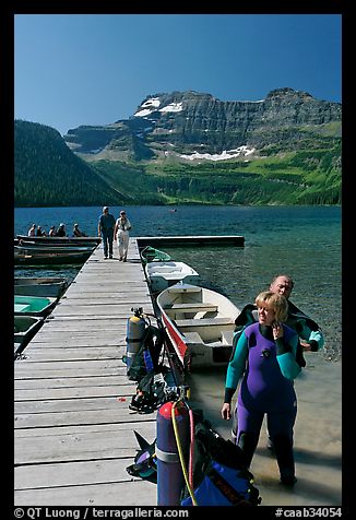 Couple preparing to scuba dive, Cameron Lake. Waterton Lakes National Park, Alberta, Canada (color)