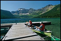 Canoists parking to dock, Cameron Lake. Waterton Lakes National Park, Alberta, Canada ( color)