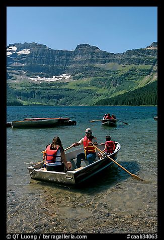 Families boating in Cameron Lake. Waterton Lakes National Park, Alberta, Canada